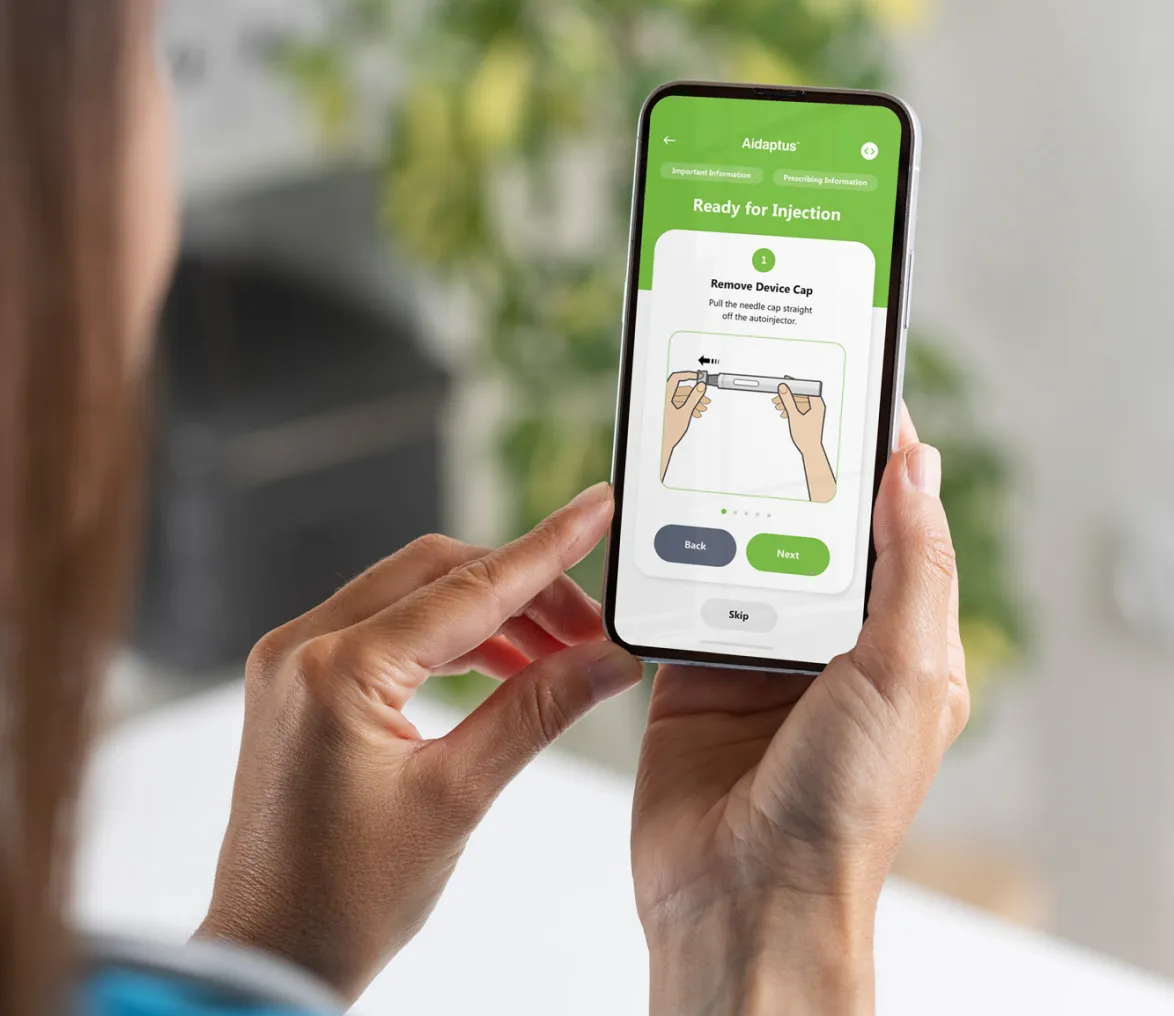 person looking at mobile with aidaptus app