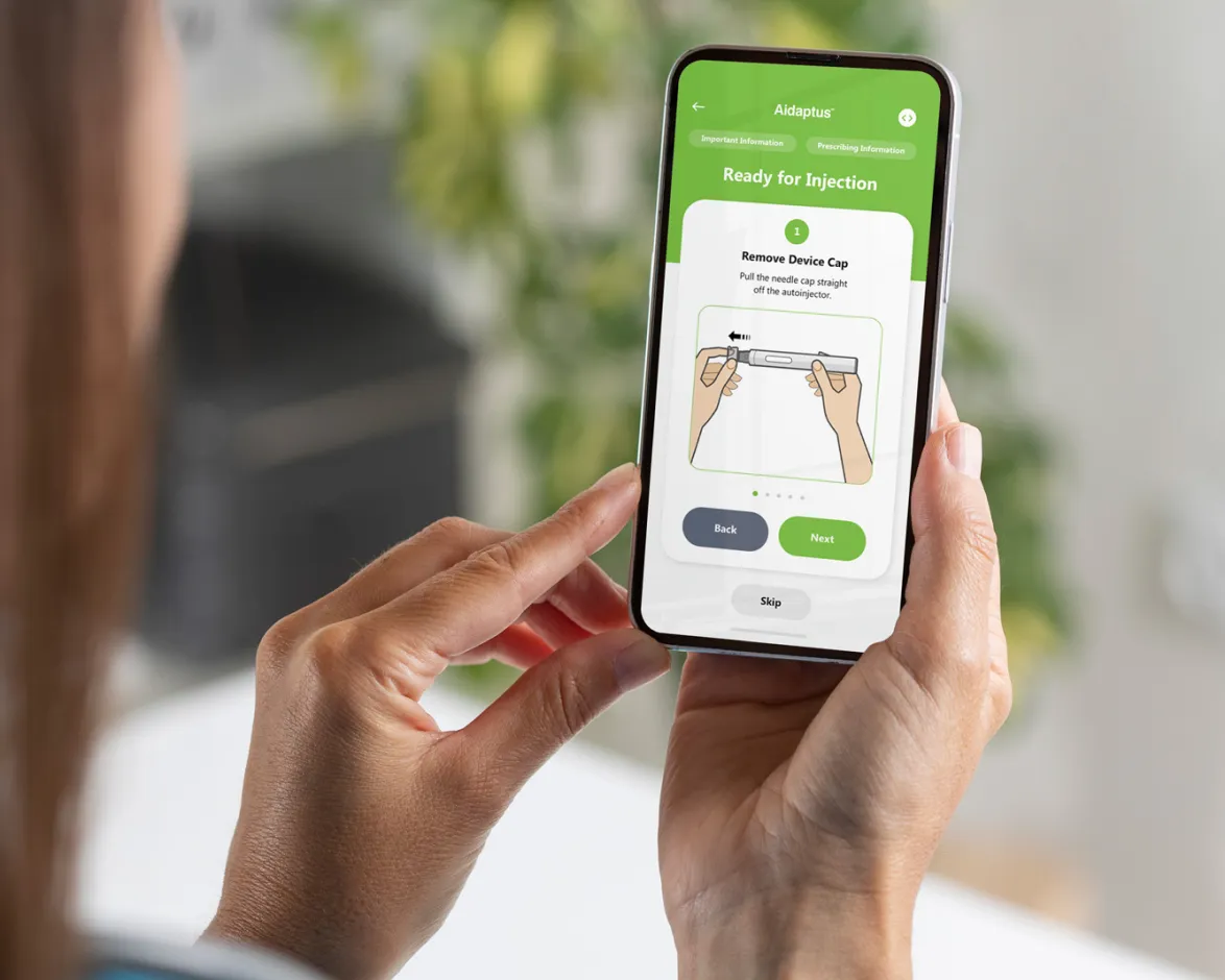 man looking at mobile with aidaptus app