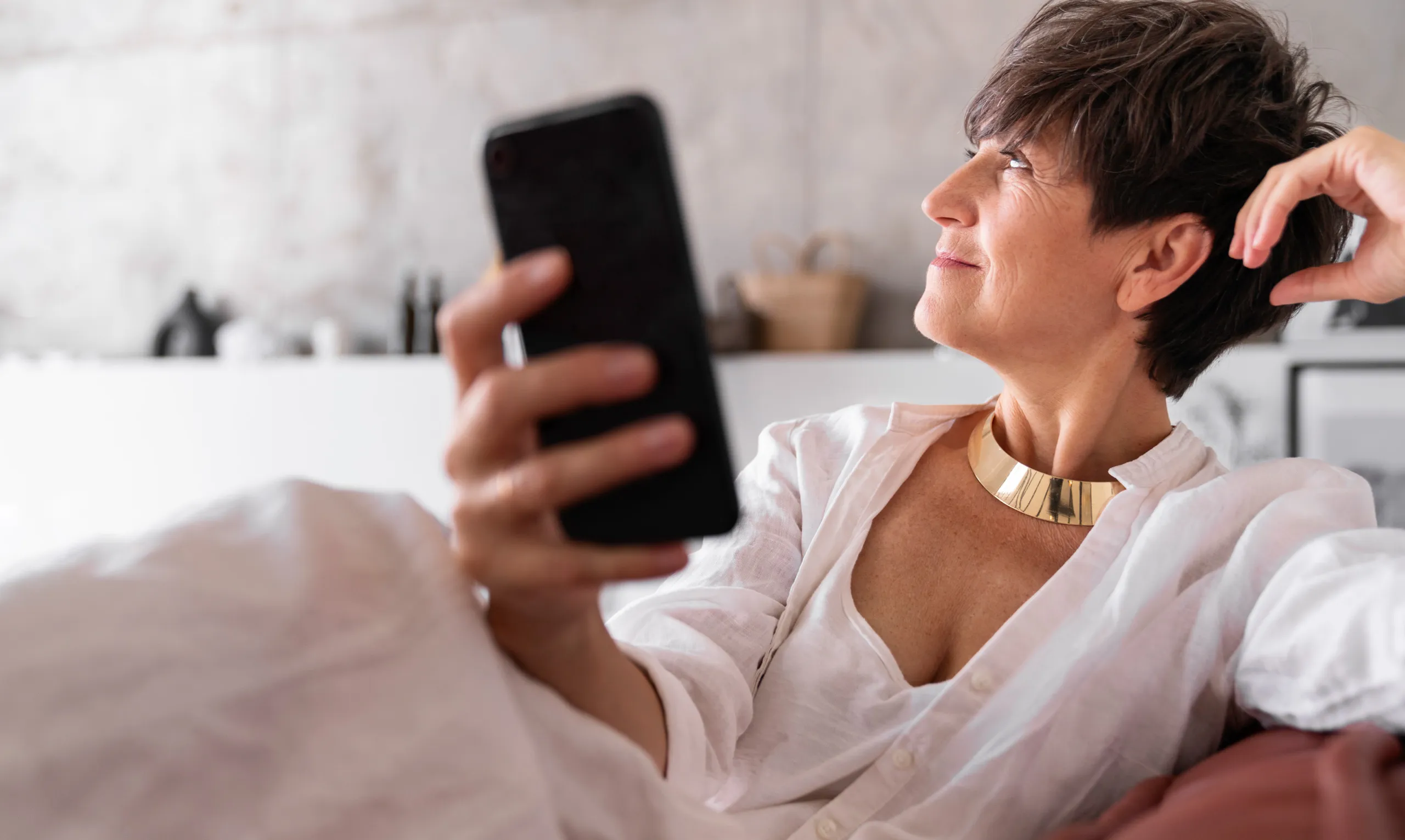 woman holding mobile in hand
